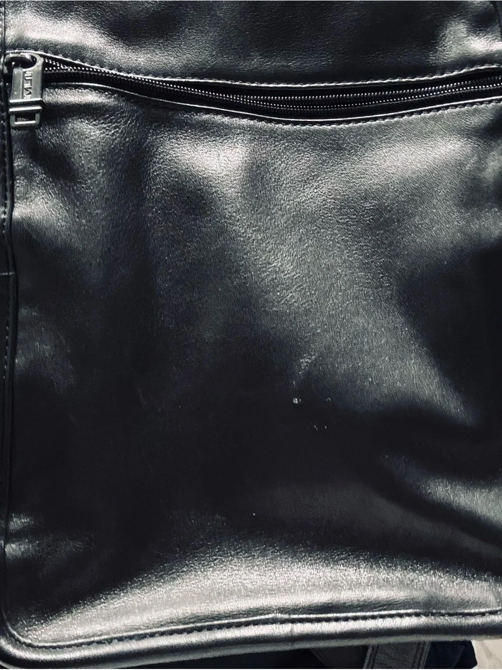 Tumi Black Leather Messenger Bag with Red Logo Tag